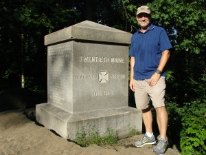 Yours truly beside the memorial to the 20th Maine Inf. on the southern slope of Little Round Top.