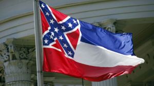 The Mississippi state flag in front of the state capitol.